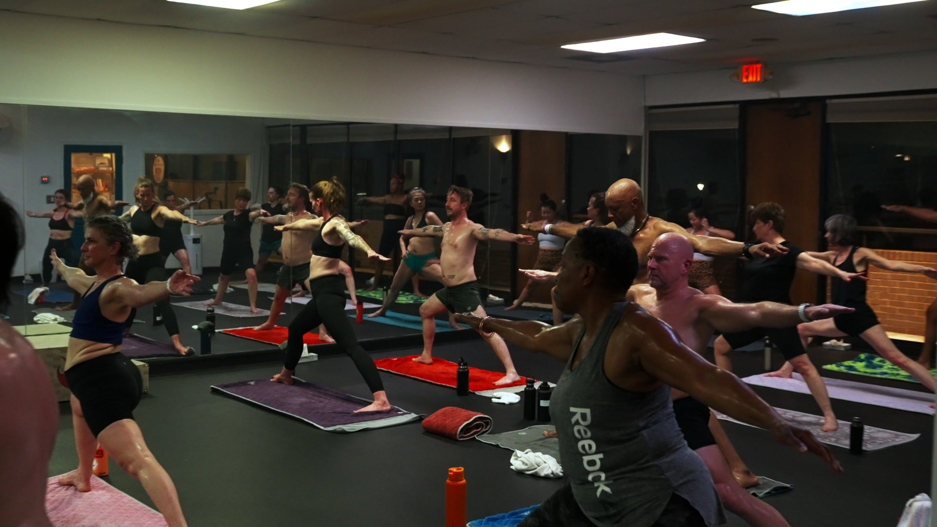 A packed class at Still Hot Yoga Decatur — all levels, all body types